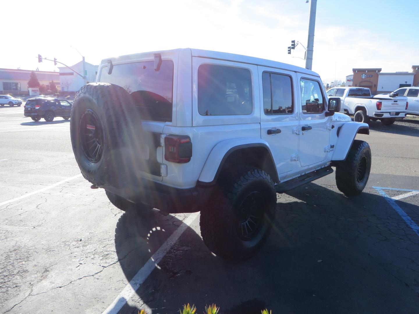 2020 White /TAN Jeep Wrangler Unlimited Rubicon (1C4HJXFG8LW) with an 3.6L V6 DOHC 24V FFV engine, 6A transmission, located at 2630 Grass Valley Highway, Auburn, CA, 95603, (530) 508-5100, 38.937893, -121.095482 - 3" Zone offroad suspension system, Fox adventure series shocks, rocksliders, Teraflex HD tire relocation, Mopar HD tailgate hinge, 17" KMC wheels, and 37" BFG KO2 tires. - Photo#4